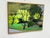 Design Plus Gallery presents a Framed Landscape Painting of Bare Trees in a Green Area. The trees in the painting may have...