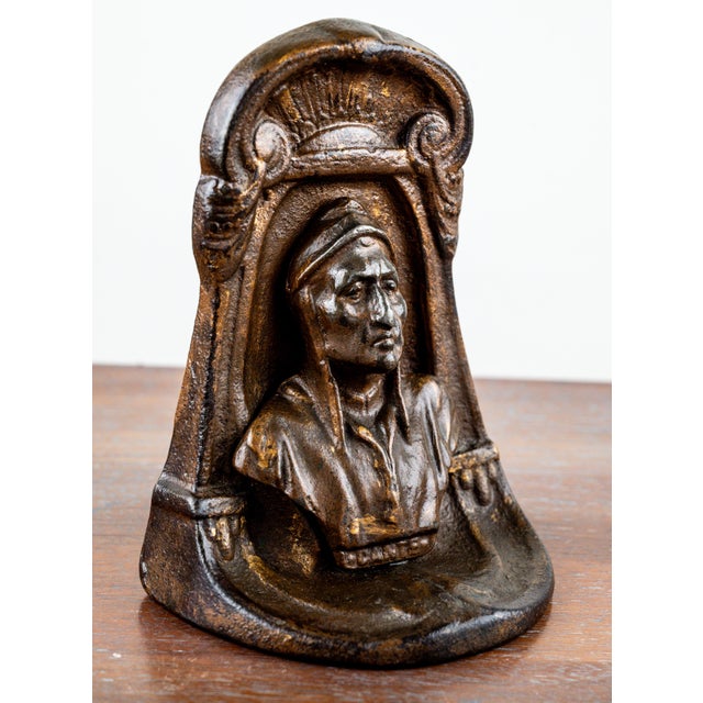 Striking early 20th-century cast-iron figural doorstop depicting Dante Alighieri, modelled in relief within an...