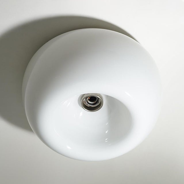 A “velella” ceiling lamp designed by the castiglioni brothers for flos in the 1960s, a project inspired by nature and its...