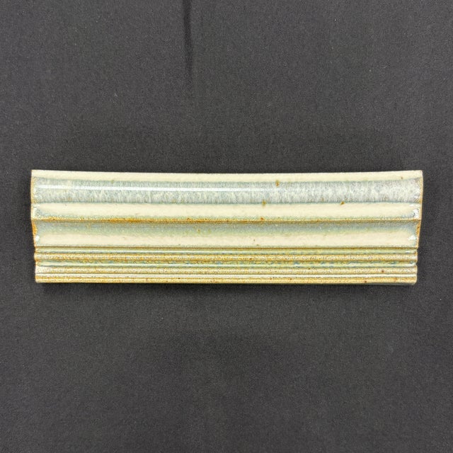 1-3/4" x 6" ceramic rail molding with a beige glaze and glossy finish. Moldings are handmade and hand glazed. High color...