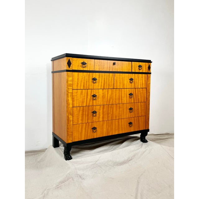 Vintage Baker Furniture Biedermeier style commode chest of drawers. Rich tiger maple with black trim. Ring hardware and...