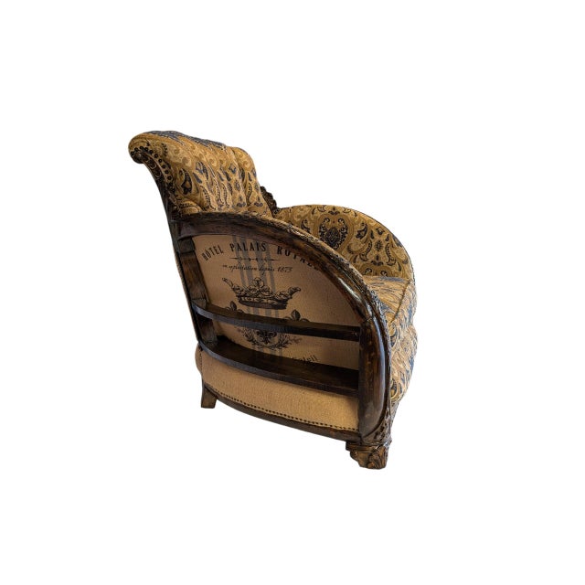 Mid-1900 vintage high-end barrel back armchair refined in a deconstructed style with a tufted barrel back and a deep and...