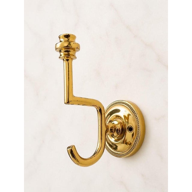 This exceptional set of seven wall hooks is crafted from high-quality solid brass and embodies the timeless elegance of...