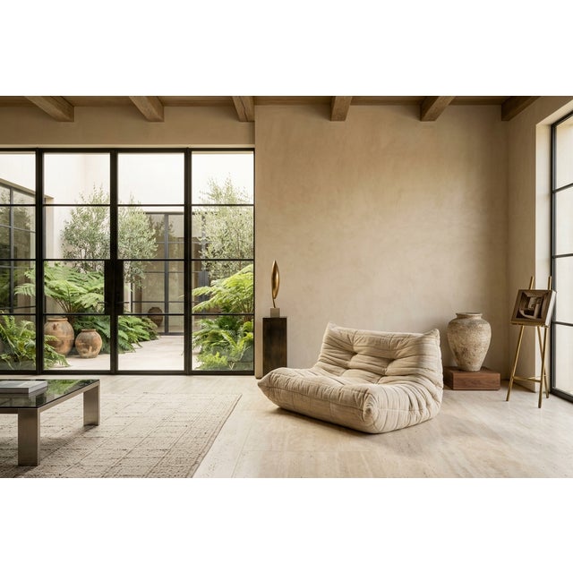 The iconic Togo sofa, designed in 1973 by Michel Ducaroy for Ligne Roset, France. Considered one of the most recognizable...