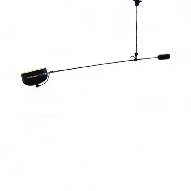 Black counter balance lamp designed by Hoogervorst for Anvia. The lamp can rotate 360 degrees. Due to the counterweight,...