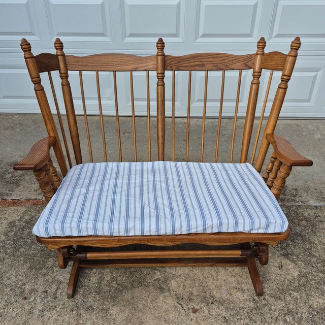 This is an unusual glider or rocking bench with colonial American styling that is very fun to sit in! The glider is made...