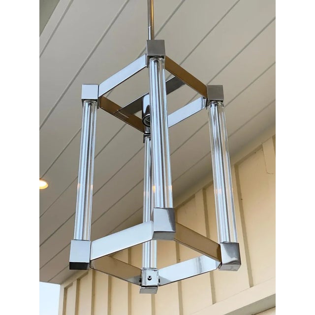 Beautiful pendant light made in chrome and glass with a height adjustable rod for the height. The piece is modern and very...