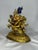A Gilt-Bronze Figure Of Mahakala with Consort. The beautifully represented classical Mahakala with 3 heads and 6 arms is...