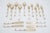 Vintage Thailand flatware set of 15, including 5 small spoons, 5 small forks, and 5 small knives. Each features brass...
