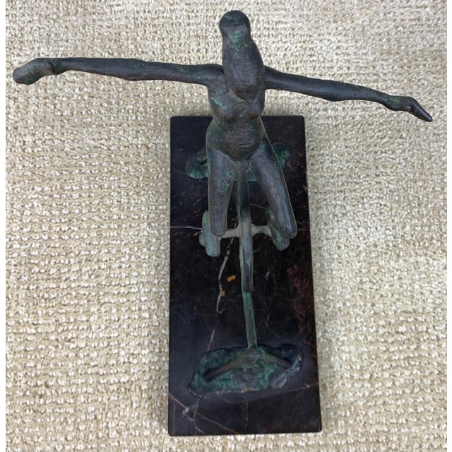 Vintage Iron High Wire Sculpture figurine mounted on stone base.
