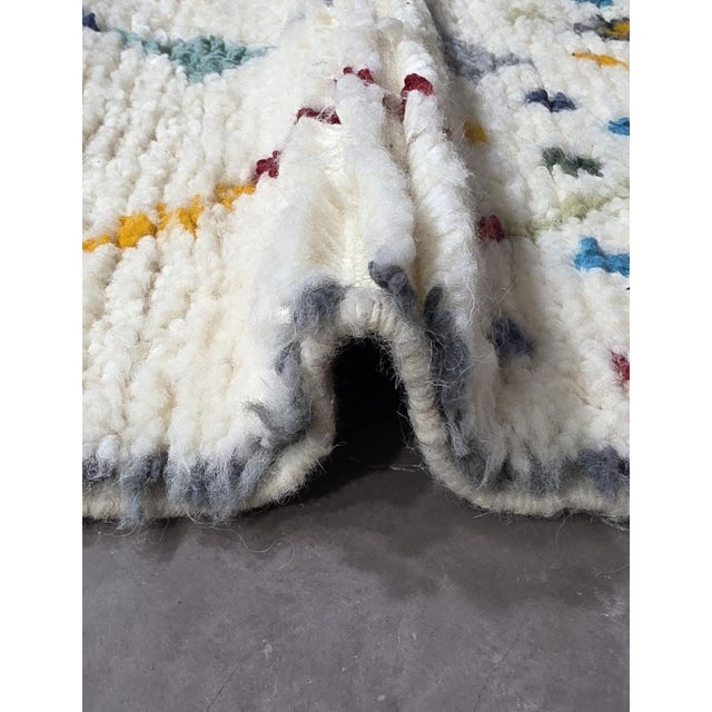 Minimalist Azilal Rug – Handmade Moroccan Berber Wool Rug This handmade Azilal rug blends minimalist elegance with playful...