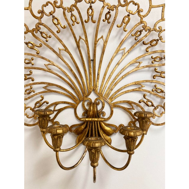 Impressively large scale gilt fan 5-arm wall candelabra sconce. Features a single wood arm with five taper candle holders...
