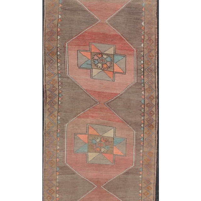 Measures: 4'3 x 14'6 Vintage Turkish Kars Gallery Runner with Muted Orange, Taupe, and Soft Teal. Keivan Woven Arts /...