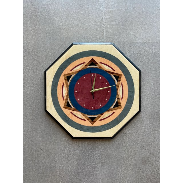 Produced in Italy circa 1980 by Valentino, this octagonal wall clock features complex wood marquetry utilizing multi-toned...