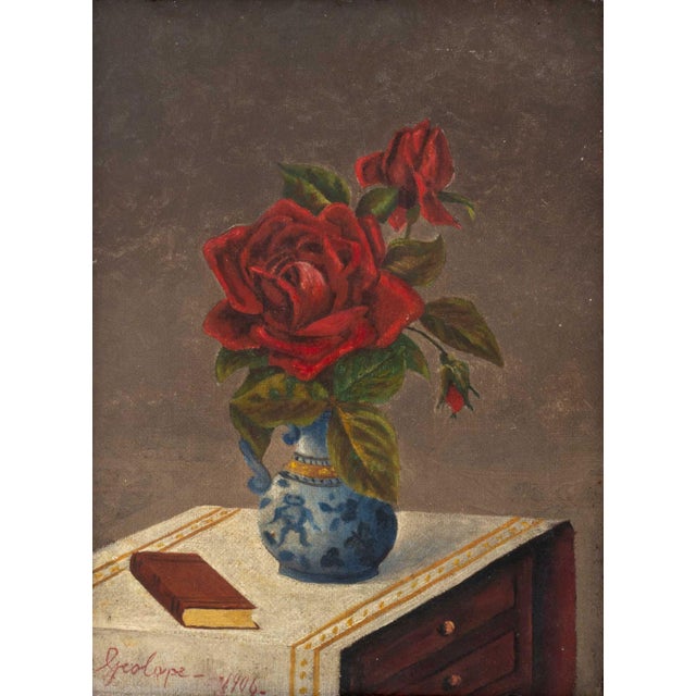 George Cope (American, 1855-1929), Still Life Scene of Red Roses in a Blue and White Vase and a Book, Oil on Canvas, 1906,...