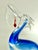 Beautiful blown art glass pelican sculpture, after the Murano glass maestro Oscar Zanetti. Features a cheeky red fish...