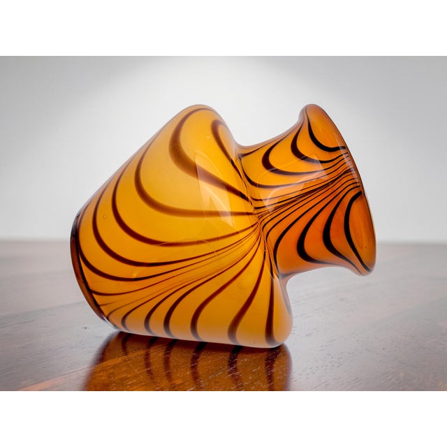 This 1980s Murano glass vase stands out for its organic, sinuous design, perfect for both classic and modern Midcentury...