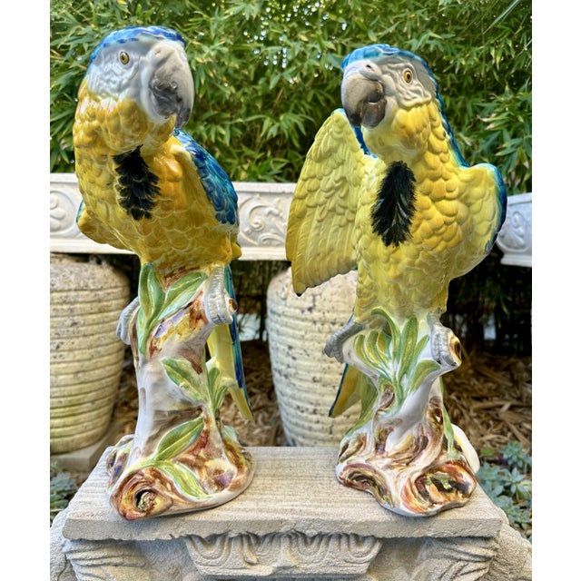 This pair of vintage large Italian hand-painted porcelain Macaw Parrot sculptures is a stunning addition to any...