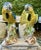 This pair of vintage large Italian hand-painted porcelain Macaw Parrot sculptures is a stunning addition to any...