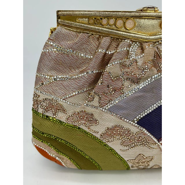 Judith Leiber Vintage Silk and Swarovski Crystal Multicolor Clutch in good condition. Multi color silk in unique swirling...