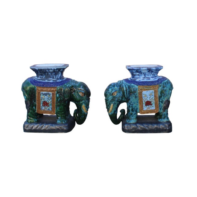 This is a traditional Chinese decorative elephant figure made of ceramic and glazed with Green Blue color. The top is...