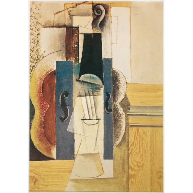An excellent photogravure, full-color print, after painting Violin Hanging on the Wall (1912-1913) by Pablo Picasso. Comes...