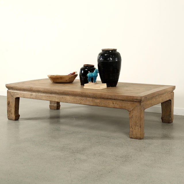 Handcrafted from reclaimed wood, this vintage extra-large coffee table brings timeless architectural character and rustic...