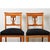 A restrained pair of German Biedermeier side chairs, circa 1820, in that timeless combination of light wood and ebonized...