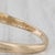 Gemstone Information: - Natural Diamonds - Total Carats - 0.65ctw (0.20ctw centers, 0.45ctw accents) Cut - Round Brilliant...