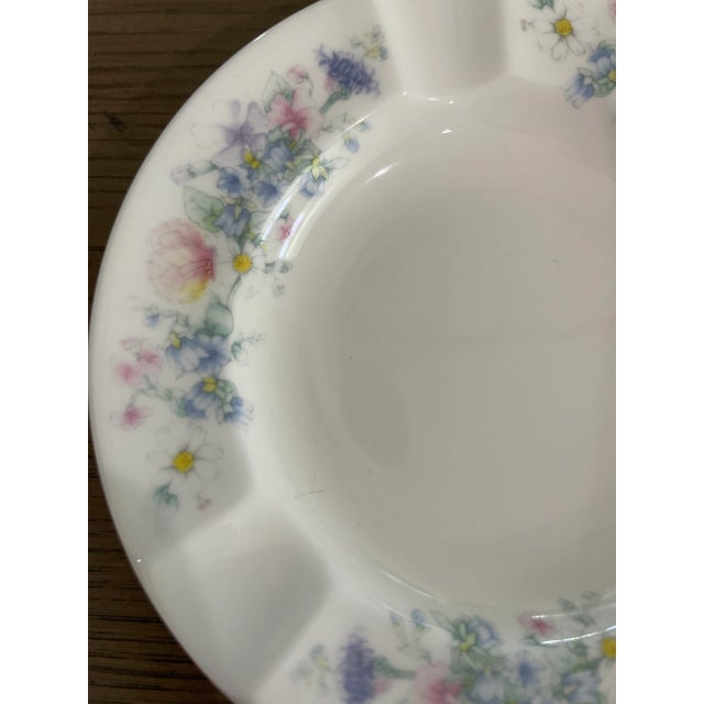 Dainty white with elegant feminine flowers on edge. A elegant piece for bathroom or dresser.