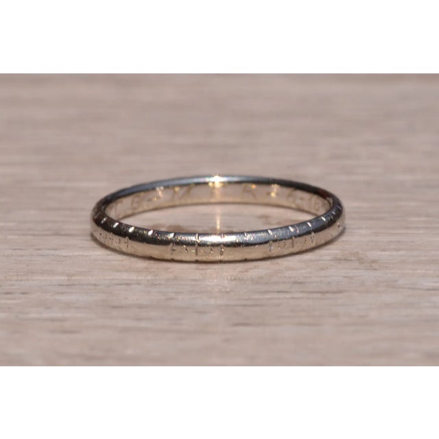 The Central Ave: White Rose Signed Antique Wedding Band Circa 1934. This antique wedding band is complete with a faintly...