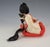 A finely crafted Japanese Hina Matsuri doll representing a traditional court lady attendant, executed in classic materials...