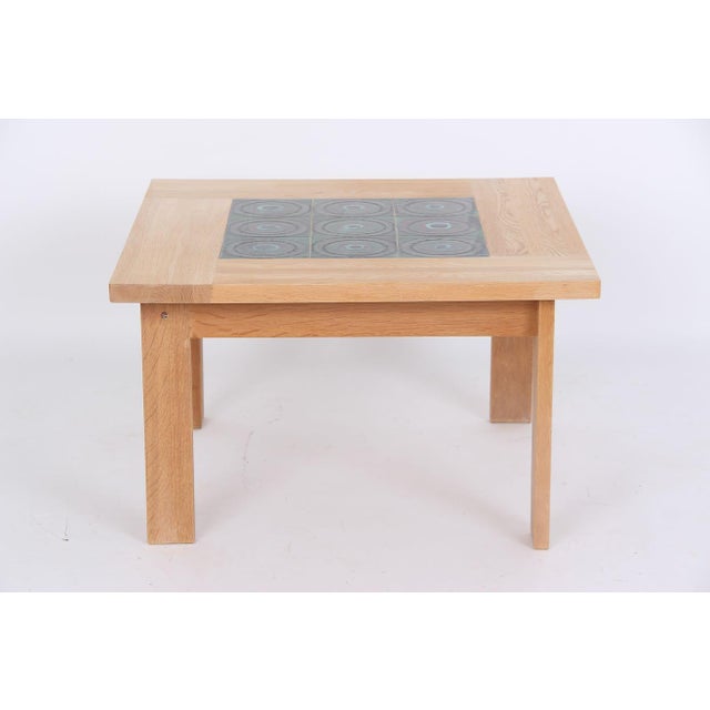 Beautiful coffee table made of solid, soaped oak with hand-painted green tiles on the tabletop. Square coffee table made...