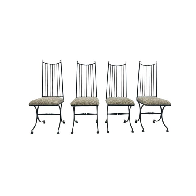 Elevate your outdoor space with this audacious midcentury ensemble—four striking wrought iron side chairs inspired by...