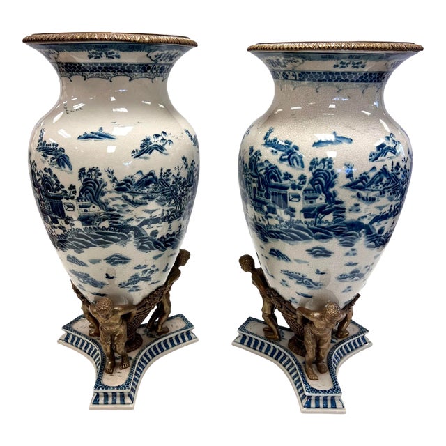 Pair of Tall Chinoiserie Blue and White Urns With Bronze Figural Mounts For Sale