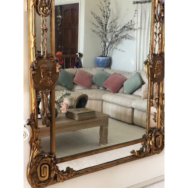 This is a monumental 19th-century Italian gilt and gesso overmantel mirror. Its exceptional scale, deeply layered...