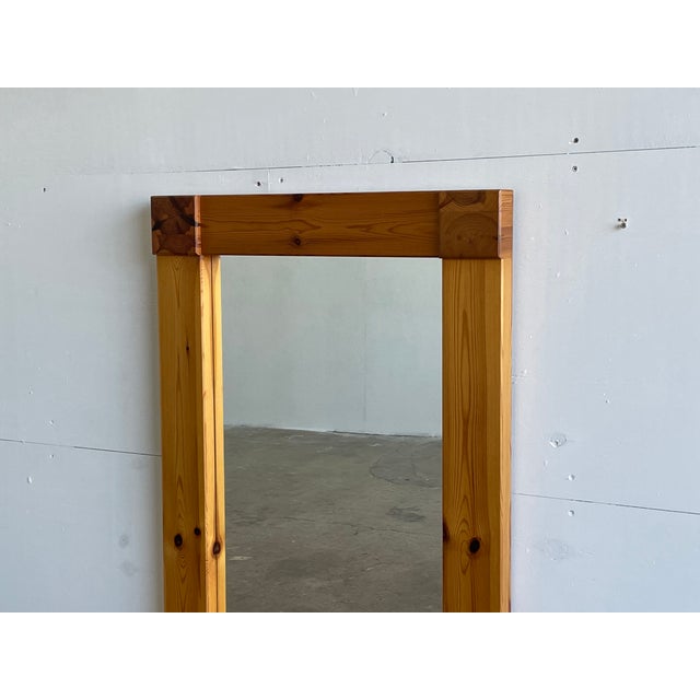A rare and striking large rectangular wall mirror in solid pine by aksel kjersgaard for his eponymous workshop in odder,...