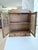 A charming and decorative Victorian oak wall cabinet with turned spindle doors — equal parts functional storage and...