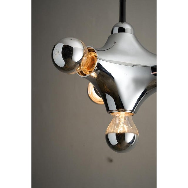 This playful "Sputnik" or "Atomic" pendant light was produced by the German manufacturer Cosack Leuchten in the 1970s...