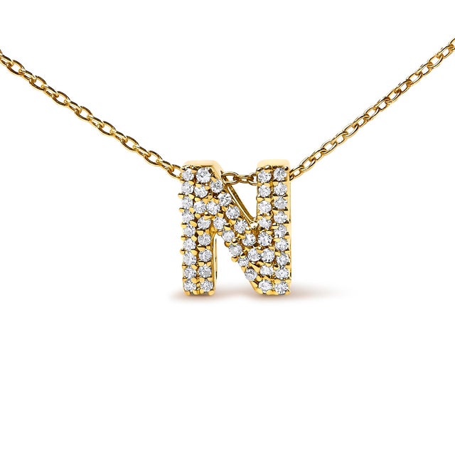 Elegance meets personalized charm in this exquisite pendant, meticulously crafted from radiant 10K yellow gold enhances...