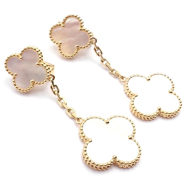 Van Cleef & Arpels 18k Yellow Gold Magic Alhambra Mother Of Pearl Earrings These earrings come with Van Cleef & Arpels...