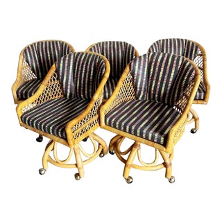 Boho Chic Buri Rattan Swivel Arm Dining Chairs on Caster With Multi Colored Cushions - Set of 5 For Sale