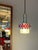 The red and chrome pendant light from Fischer Leuchten in western Germany combines elegant style with high-quality...