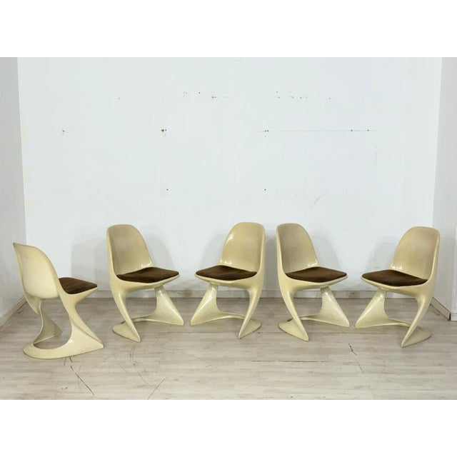 For sale is an iconic set of five Casalino chairs by Casala from the Space Age era. These design classics impress with...
