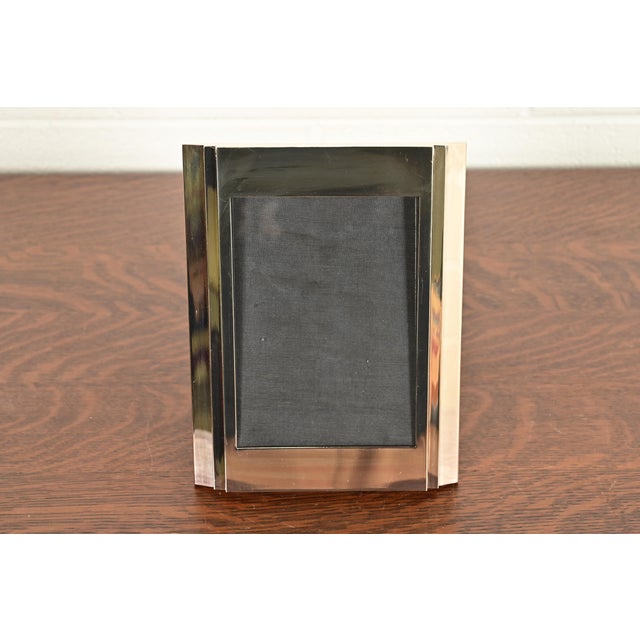 A gorgeous modern Art Deco silver plate picture frame By Ralph Lauren USA, Circa Late 20th Century Measures: 7.25"W x...