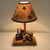 Vintage wooden table lamp/nightlight with music box by Nursery Original Inc. Design features a colorful wooden toy train...