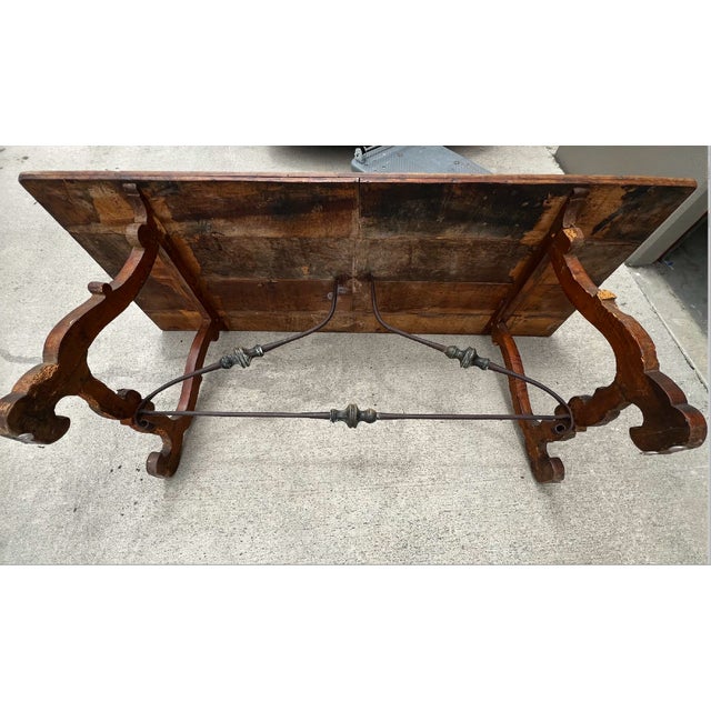 A striking example of late 19th-century Southern European craftsmanship, this Spanish Baroque style trestle table...