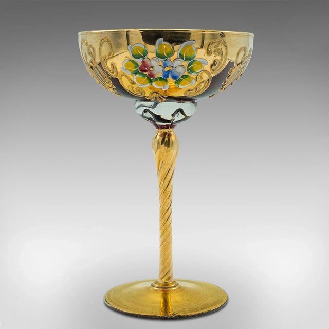 This is a vintage Venetian libation cup. An Italian, art glass and gilt finished decorative wine flute, dating to the late...