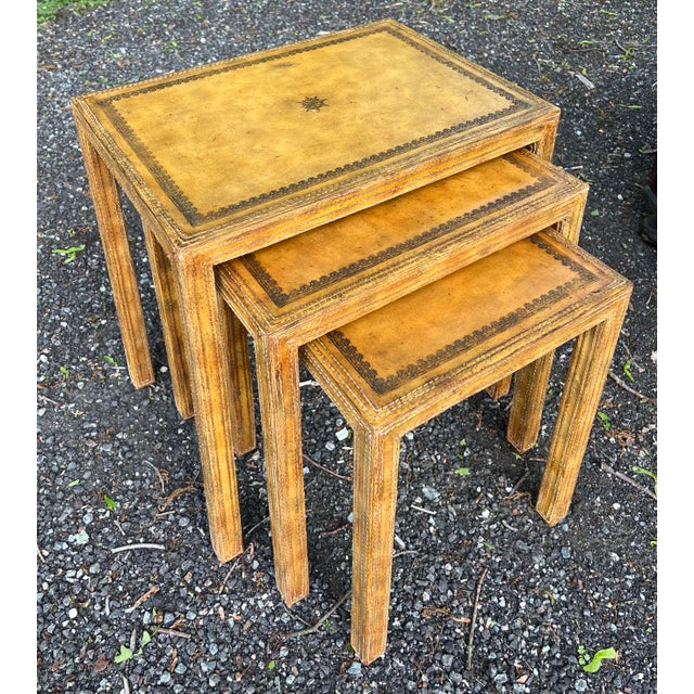 Vintage set of three hard to come by hand tooled and hand stitched leather nesting tables by Maitland Smith. Intentionally...