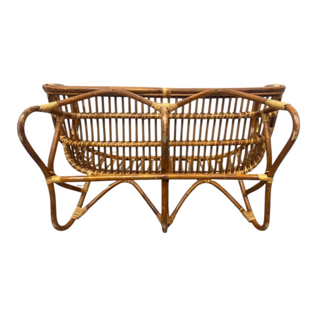This is a handwoven rattan and cane settee of love seat, designed in the spirit of Franco Albini. The piece has a lovely...